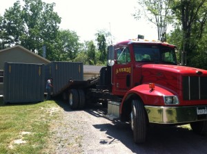 Delivery Specialist Dropping Off 2 20' Shipping Containers